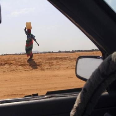 A woman carries water in Al Fashir, capital of North Darfur, Sudan, September 6, 2016.