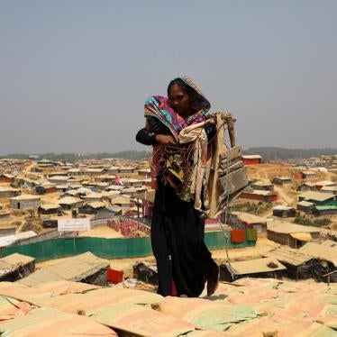 A Rohingya woman walks through Kutupalong refugee camp in Cox’s Bazar, Bangladesh, March 22, 2018.
