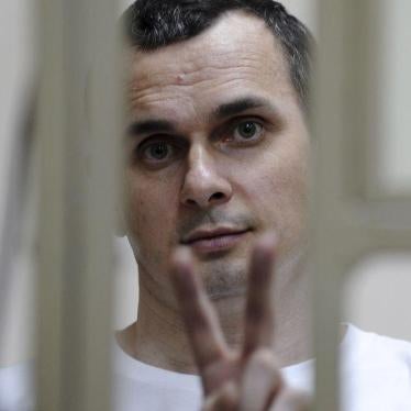 Ukrainian film director Oleg Sentsov gestures from a defendants' box as he attends a court hearing in Rostov-on-Don, Russia, July 21, 2015. 