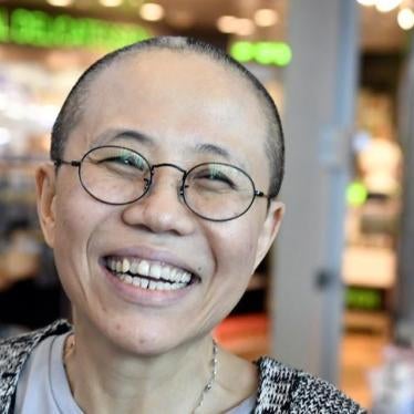 Liu Xia, the widow of Chinese Nobel Peace Prize-winning political dissident Liu Xiaobo, smiles as she arrives at the Helsinki International Airport in Vantaa, Finland, July 10, 2018. Lehtikuva/Jussi Nukari via REUTERS 