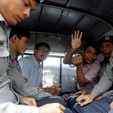 Reuters journalists Wa Lone and Kyaw Soe Oo leave Insein court in a police van in Yangon, Myanmar, July 9, 2018.