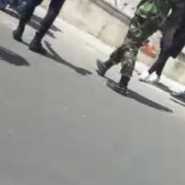 A still from video shows handcuffed detained protestors in front of Evin prison in Tehran, Iran, August 26, 2018.  © 2018 Private