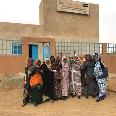 Aminetou Mint Ely [center, holding phone], president of the Association of Women Heads of Family and staff of a support center for survivors of gender-based violence, run by the association, Rosso, Mauritania, February 7, 2018. 