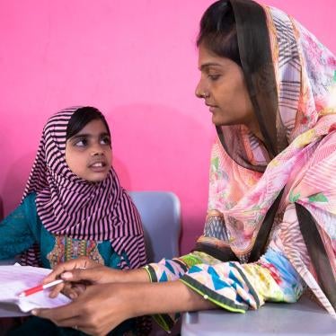 Laiba, age eight, with Shazia, the founder of the lyari School. 