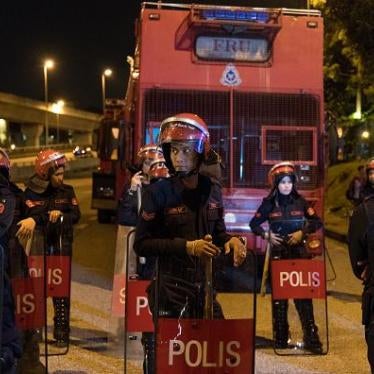 Riot police members stand guard at the Seafield temple on November 27, 2018 in Subang Jaya, Selangor, Malaysia. The priest says there are criminal elements involved in the attack on the temple yesterday. Temple chief priest Jeyakumar Subramaniam said he s