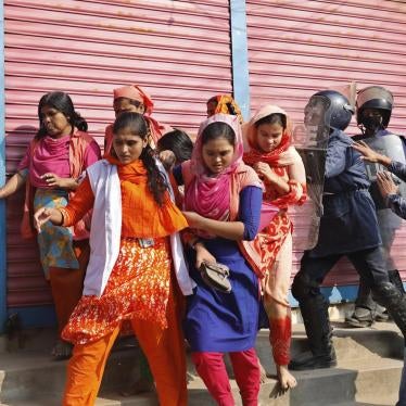 Bangladesh police chase protesting garment workers in Savar, outside Dhaka, Bangladesh, January 9, 2019.