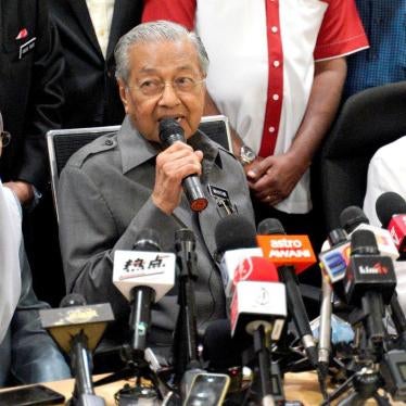 Malaysian Prime Minister Mahathir Mohamad, center, speaks next to Deputy Prime Minister Wan Azizah Wan Ismail, left, and People's Justice Party President Anwar Ibrahim, right, during a press conference in Kuala Lumpur, Malaysia, Friday, Jan. 4, 2019.