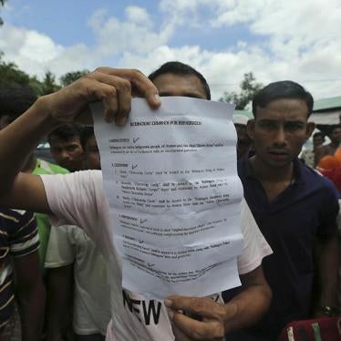 A Rohingya refugee displays to journalists a demand letter about Rohingya repatriation at Nayapara camp in Cox's Bazar, Bangladesh, Thursday, Aug.22, 2019. 