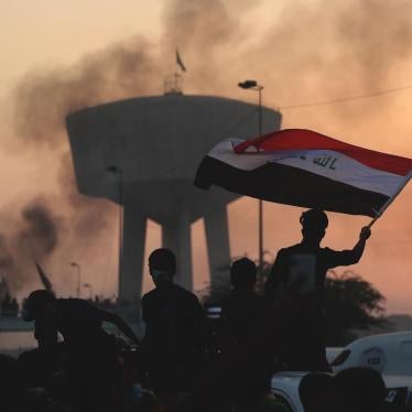 Anti-government protesters chant slogans during a protest in Baghdad, Iraq