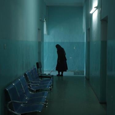 An employee cleans the corridor of the women's ward at the mental health hospital in Kabul, November 2012.