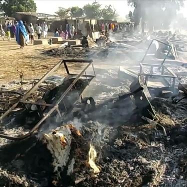 Smoldering ashes and charred items are seen on the ground in Badu near Maiduguri, Nigeria, on July 28, 2019, after a suspected attack by Boko Haram fighters on a funeral.