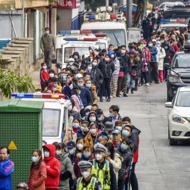 People line up to buy face masks from a medical supply company in Nanning, southern China's Guangxi Zhuang Autonomous Region. 