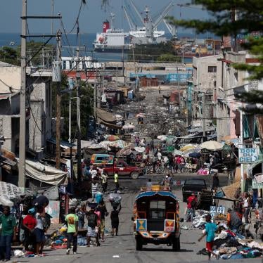 People go about their day in Port-au-Prince, Haiti, Saturday, Oct. 5, 2019.