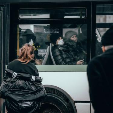 A woman rides a bus wearing face protective mask amid concerns over the coronavirus, in Nur-Sultan, Kazakhstan, March 16, 2020. 