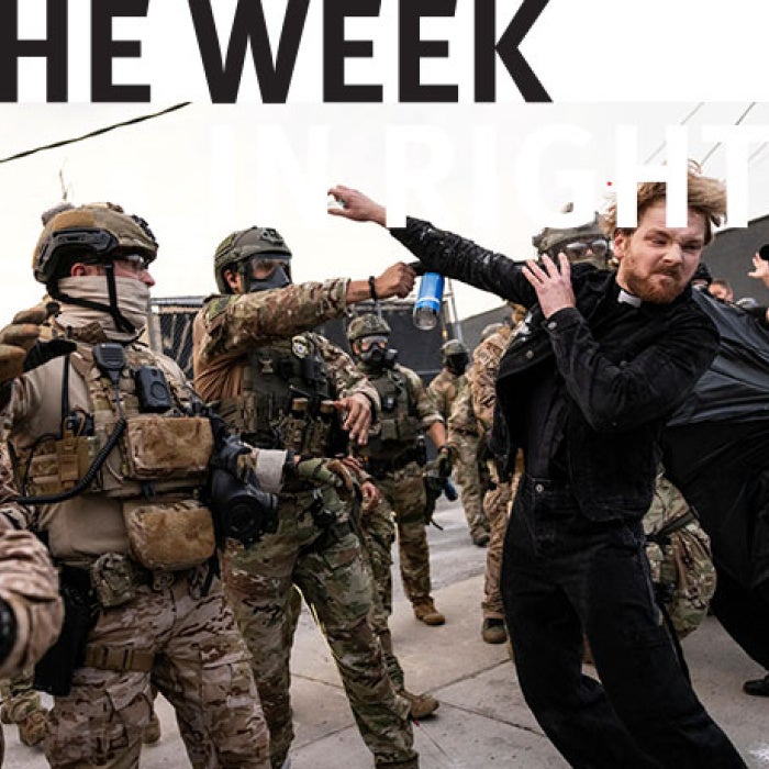 Protesters confront military personnel. 